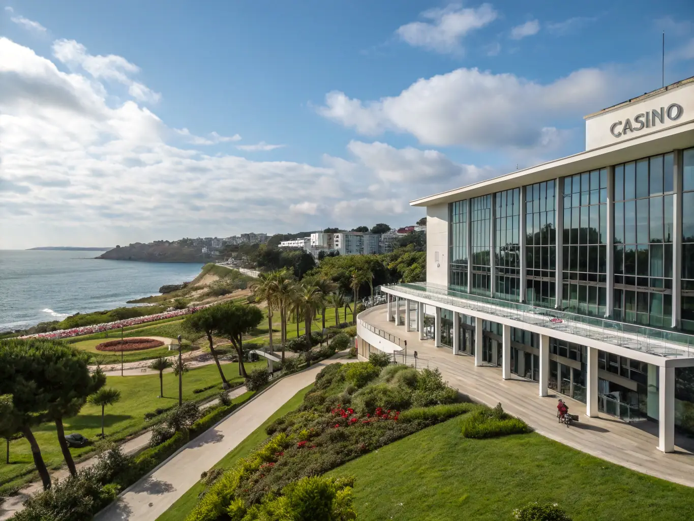 An image of Casino Estoril in Portugal, capturing its modern architecture and vibrant atmosphere, with a view of the surrounding gardens and coastline.